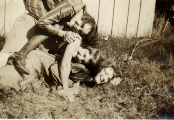 Ida Seay and sisters in a dog pile